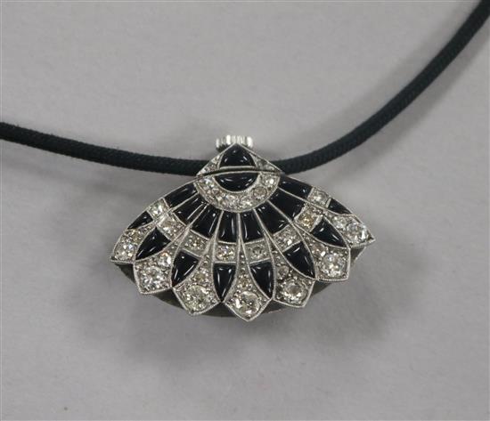 An Art Deco style white metal, diamond and black onyx set fan shaped pendant watch, on a fabric necklace, watch 30mm.